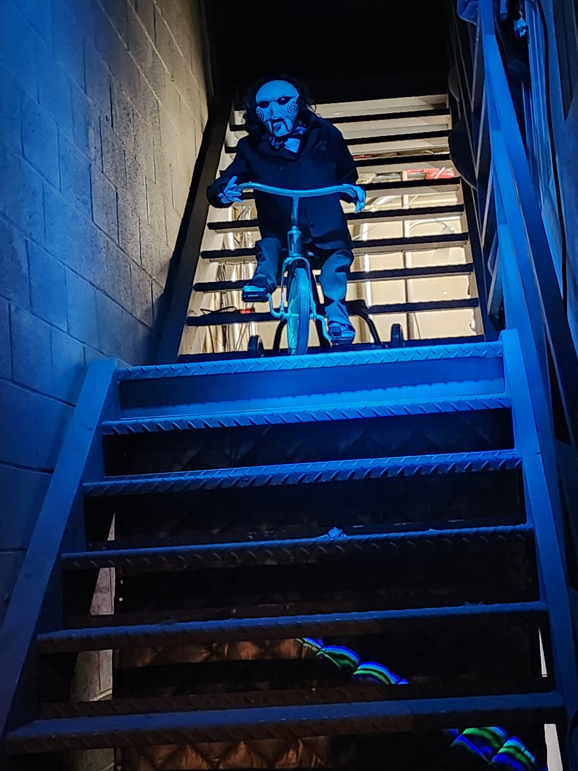 Jigsaw puppet on bike